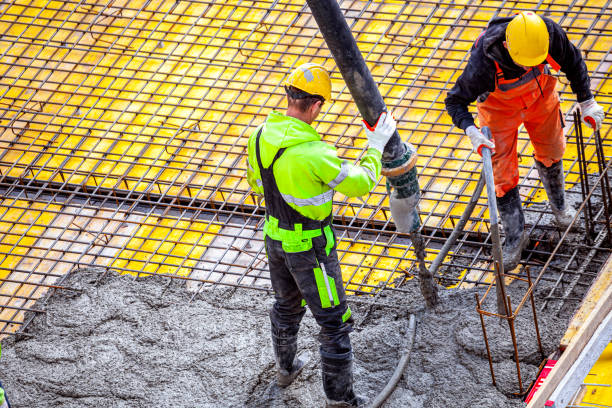 istock Concrete pouring on the construction site. 1392525046