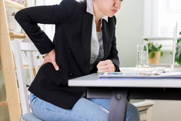 istock Young busines woman suffering with back pain 1392529651