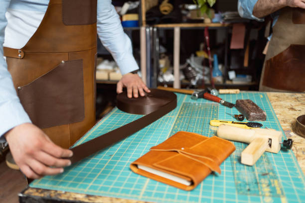 istock Unrecognizable Caucasian male tailors, working together at the tailor workshop 1392529993