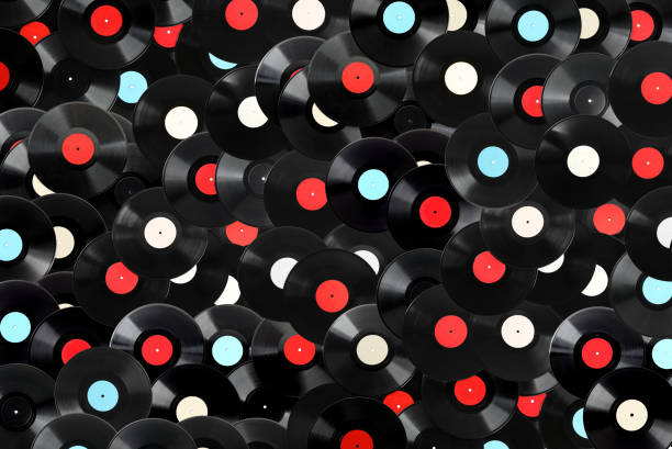 istock Black vintage vinyl records as background, top view 1392531154