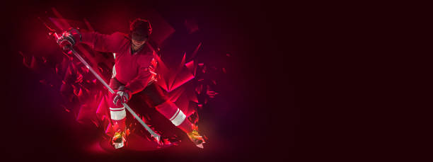 istock Young man, professional hockey player in protective uniform training isolated on dark background polygonal, fluid neon elements. Concept of sport 1392532827
