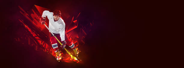 istock Young man, professional hockey player in protective uniform training isolated on dark background polygonal, fluid neon elements. Concept of sport 1392532838