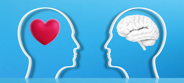 istock Different thoughts and emotions concept. Two heads one with a brain in one with heart. 1392532892