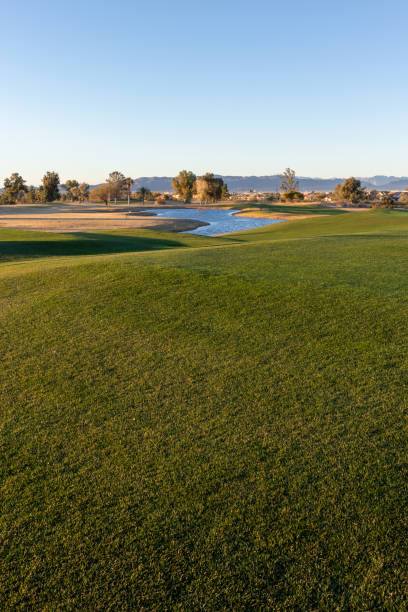 istock Golf course fairway view toward water hazard 1392533890