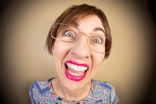 istock Happy Fisheye Middle Age Woman 1392536559