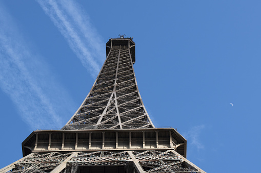 Paris: view from below of The Eiffel Tower, metal tower completed in 1889 by Gustave Eiffel for the Universal Exposition and became the most famous monument in Paris