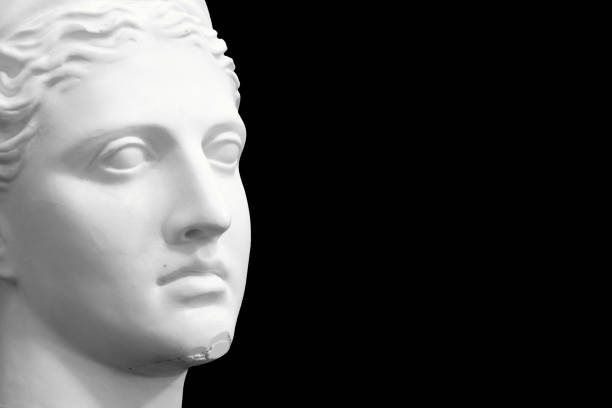 istock white plaster female statue isolated on black background 1392538958