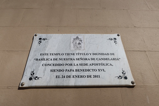 Candelaria, Tenerife, Canary Islands, Spain, March 8, 2022: Plaque on the facade of the Basilica of Candelaria in Tenerife. Spain