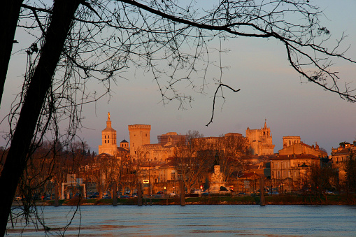In winter dusk, the setting sun shines on the ancient town of Avignon\ndusk