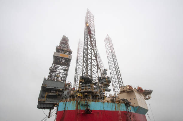 Oil rig closeup from below and grey sky. Esbjerg Denmark