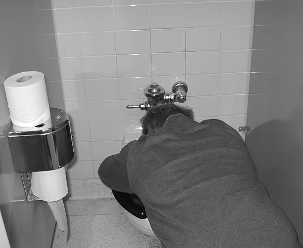 Sick man at toilet closeup