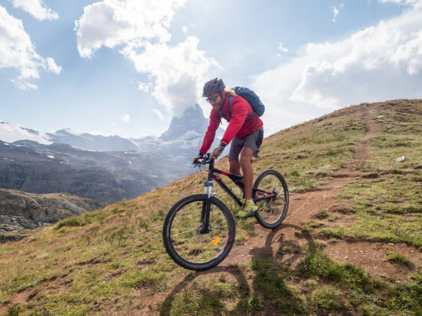 istock Mountain biker on dirt trail, Switzerland 1392543502