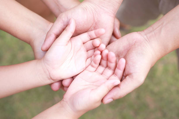 istock Hand focus. True love is love from family. 1392543883