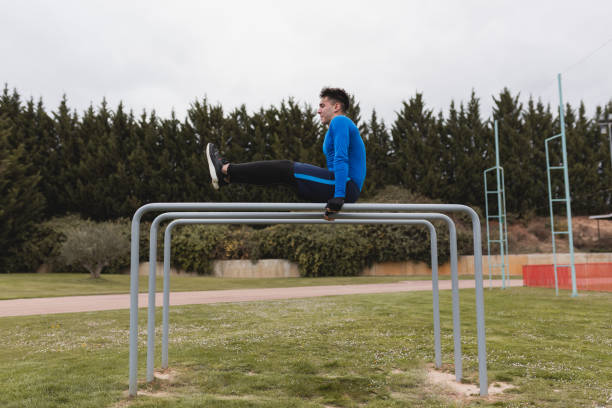 istock Young man practicing calisthenics outdoor. 1392544920