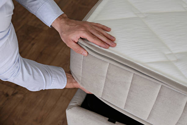 istock Man choosing a mattress. 1392545001