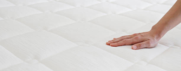 istock Woman choosing a mattress. 1392545045