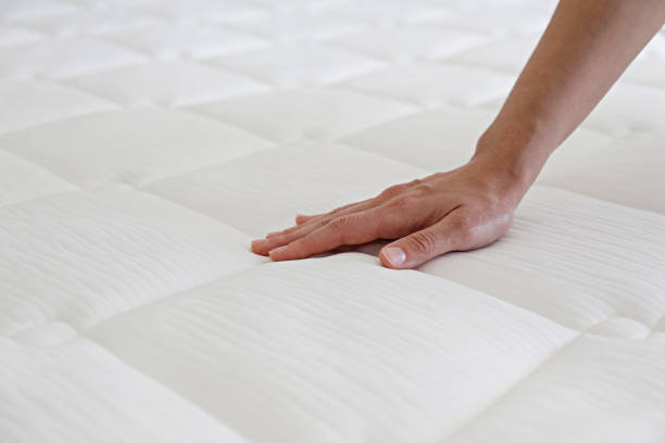 istock Woman choosing a mattress. 1392545099