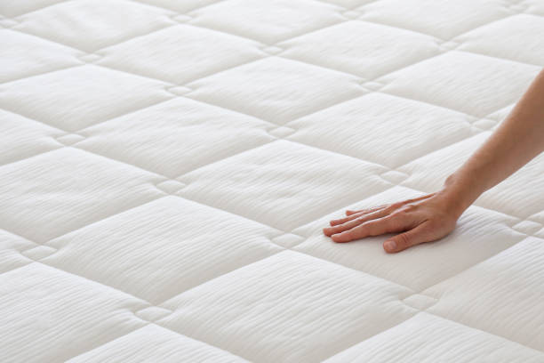 istock Woman choosing a mattress. 1392545135