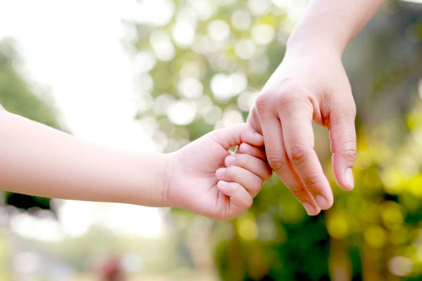 istock Hand focus. True love is love from family. 1392545193