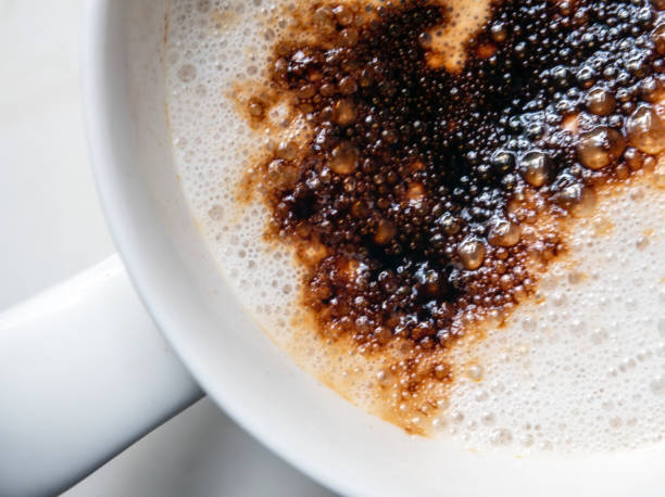 istock Coffee stains on white coffee cup that have been left in a coffee shop 1392545394