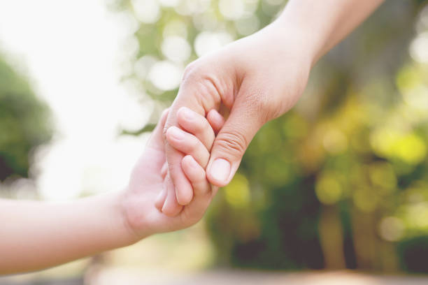 istock Hand focus. True love is love from family. 1392545455