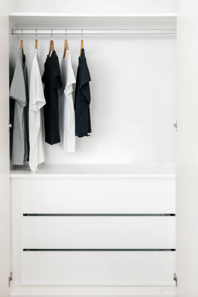 istock Diversity of T-shirts in modern styled dressing room 1392545766