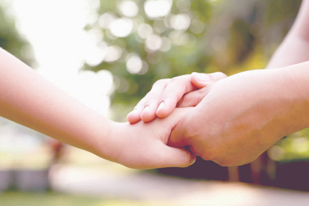 istock Hand focus. True love is love from family. 1392546749