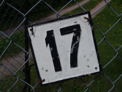 I simple sign with the number 17 on it