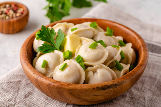 Homemade meat dumplings - russian pelmeni. Homemade meat dumplings - russian pelmeni. Dumplings, filled with meat, ravioli. russian pelmeni stock pictures, royalty-free photos & images