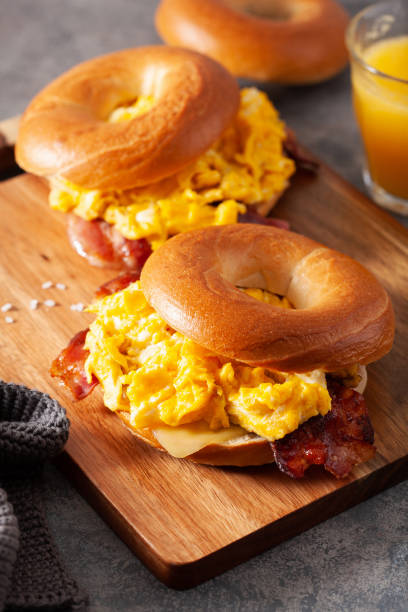 istock breakfast egg and bacon sandwich on bagel with cheese 1392553034