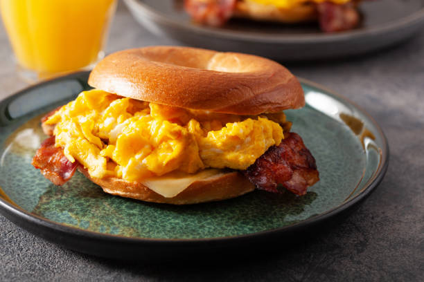 istock breakfast egg and bacon sandwich on bagel with cheese 1392553059