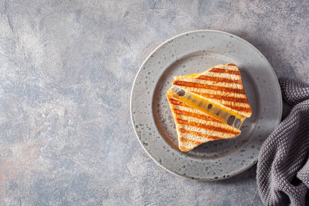 istock grilled cheese sandwich on gray concrete background 1392553085