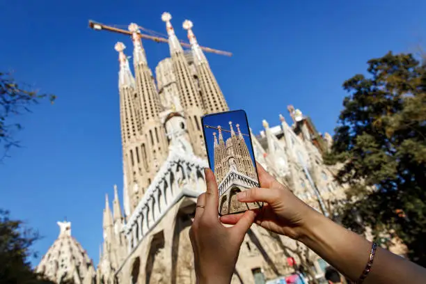 Photo of Using a mobile phone camera to take pictures of Sagrada Familia in Barcelona, Spain.