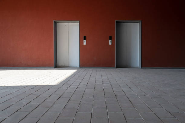 Empty elevator entrance facade and red walls