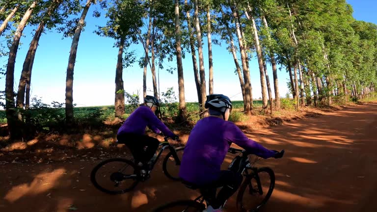 senior couple riding a bicycle