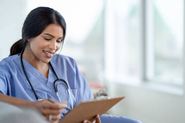 istock Female Nurse Casually Sitting 1392555706