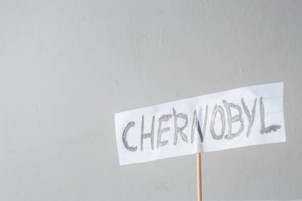 istock Chernobyl,word written on a cut paper,soured white background and copy space 1392555776