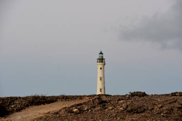 istock California Lighthouse at Sunrise with Rugged Landscape 1392555918