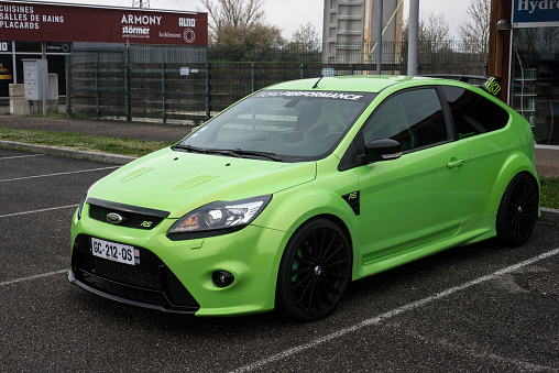 Lutterbach - France - 3 April 2022 - Profile view of green Ford focus RS parked in the street