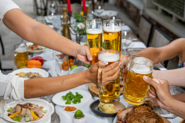 Cropped shot of an unrecognizable couple toasting at a resort in nature