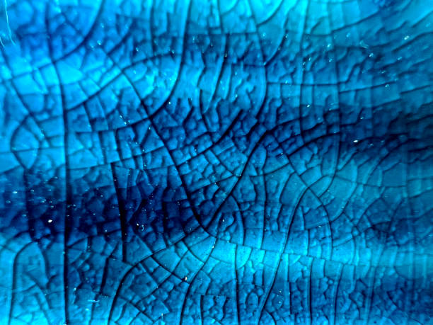 istock A blue and cracked glass as a texture or background. 1392557477