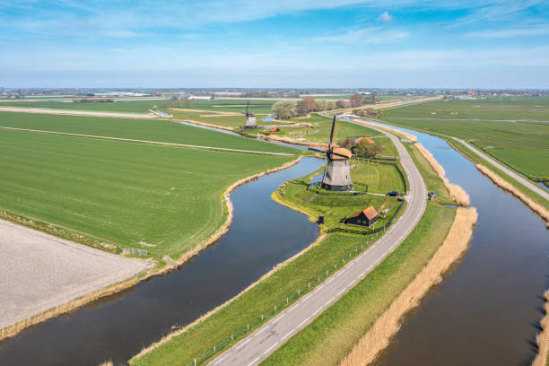 istock Typical Dutch polder landscape with windmill 1392558971