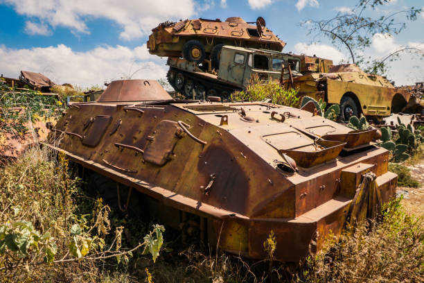 istock Destroyed War Machines and Tanks rounded by Cactuses on the Tank Graveyard in Asmara 1392563292