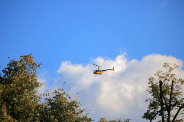 Helicopter Agusta-Westland AW139 PH-PXY of the Dutch Police Aviation Service fitted with camera's for surveillance. The Helicopter is flying in mid air and searching for shoplifters in Kampen, The Netherlands.