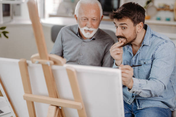istock Painting together 1392565388