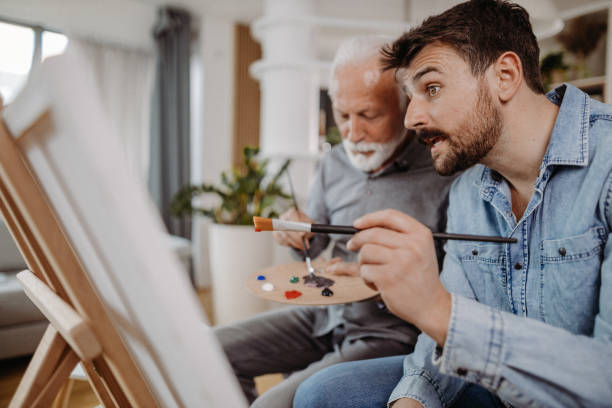 istock Painting together 1392565460