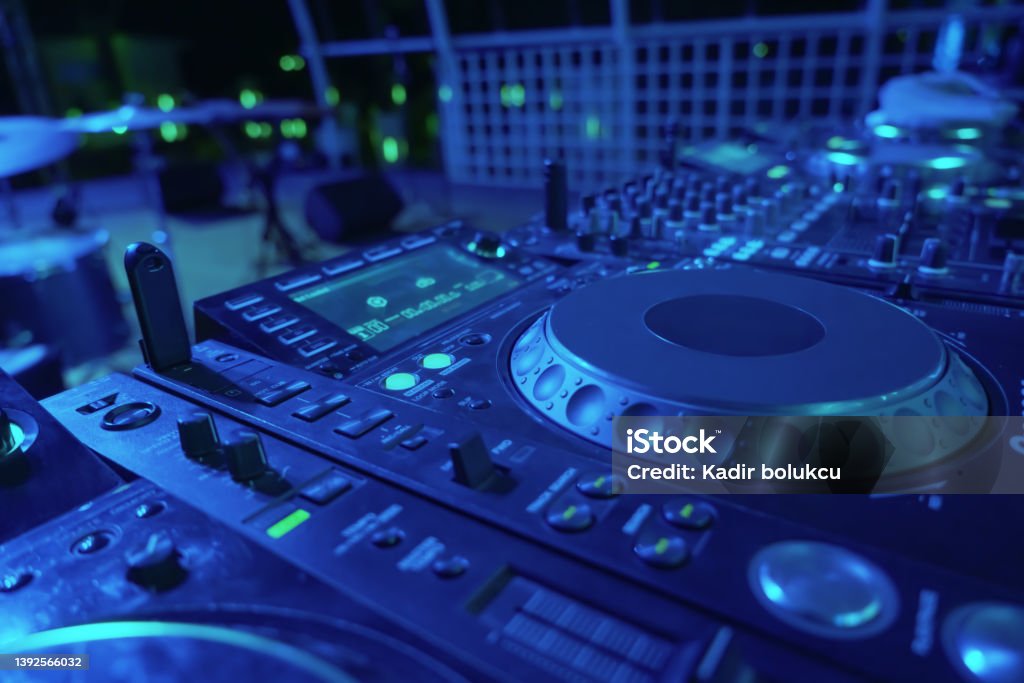 DJ console desk at nightclub. Studio - Workplace Stock Photo