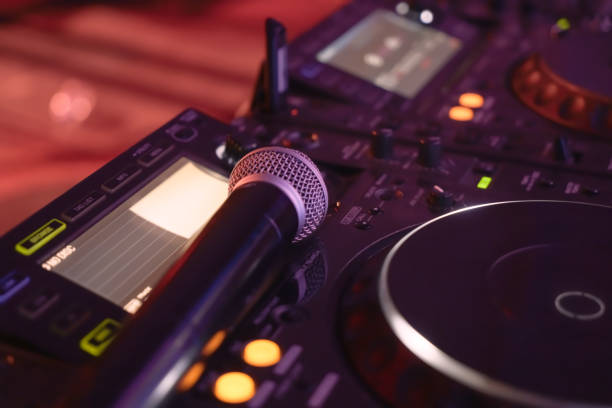 istock DJ equipment mixing board and microphone. 1392566190