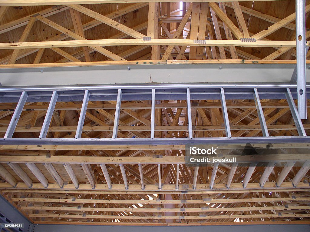 Construction Framework Interior view of a commercial building under construction. Beams and support rafters are visible in this photo. Business Stock Photo