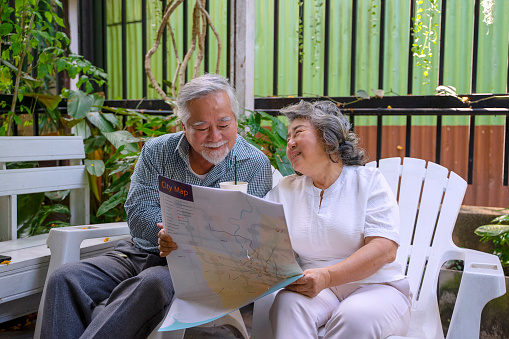 Senior couple travel on urban street. Active senior lifestyle.